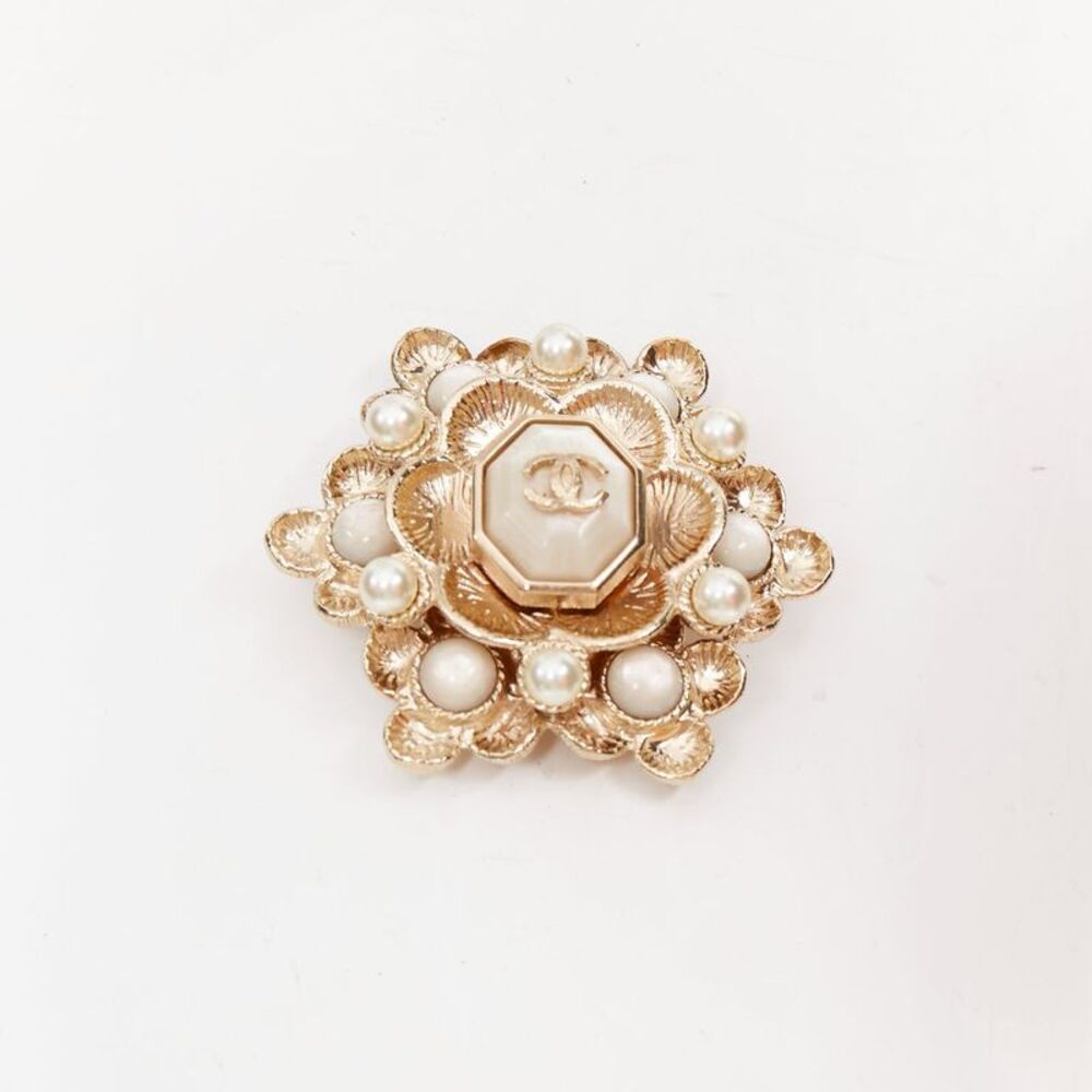 Chanel gold tone CC faux pearl medallion brooch